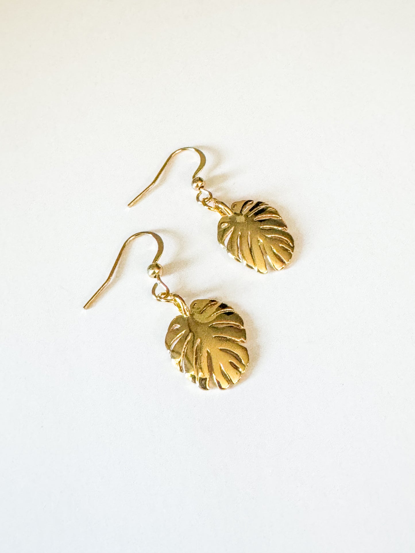 gold monstera earrings