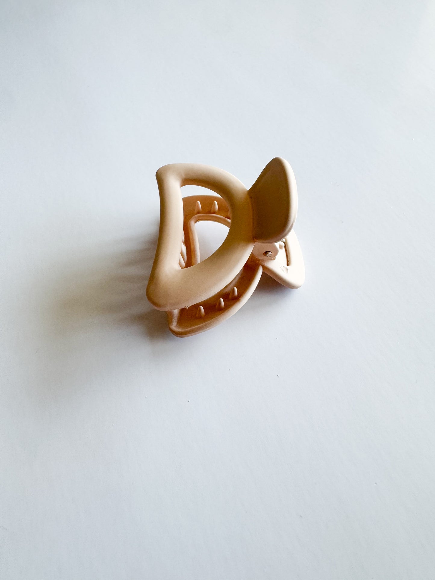 small semicircle hair claw in tan