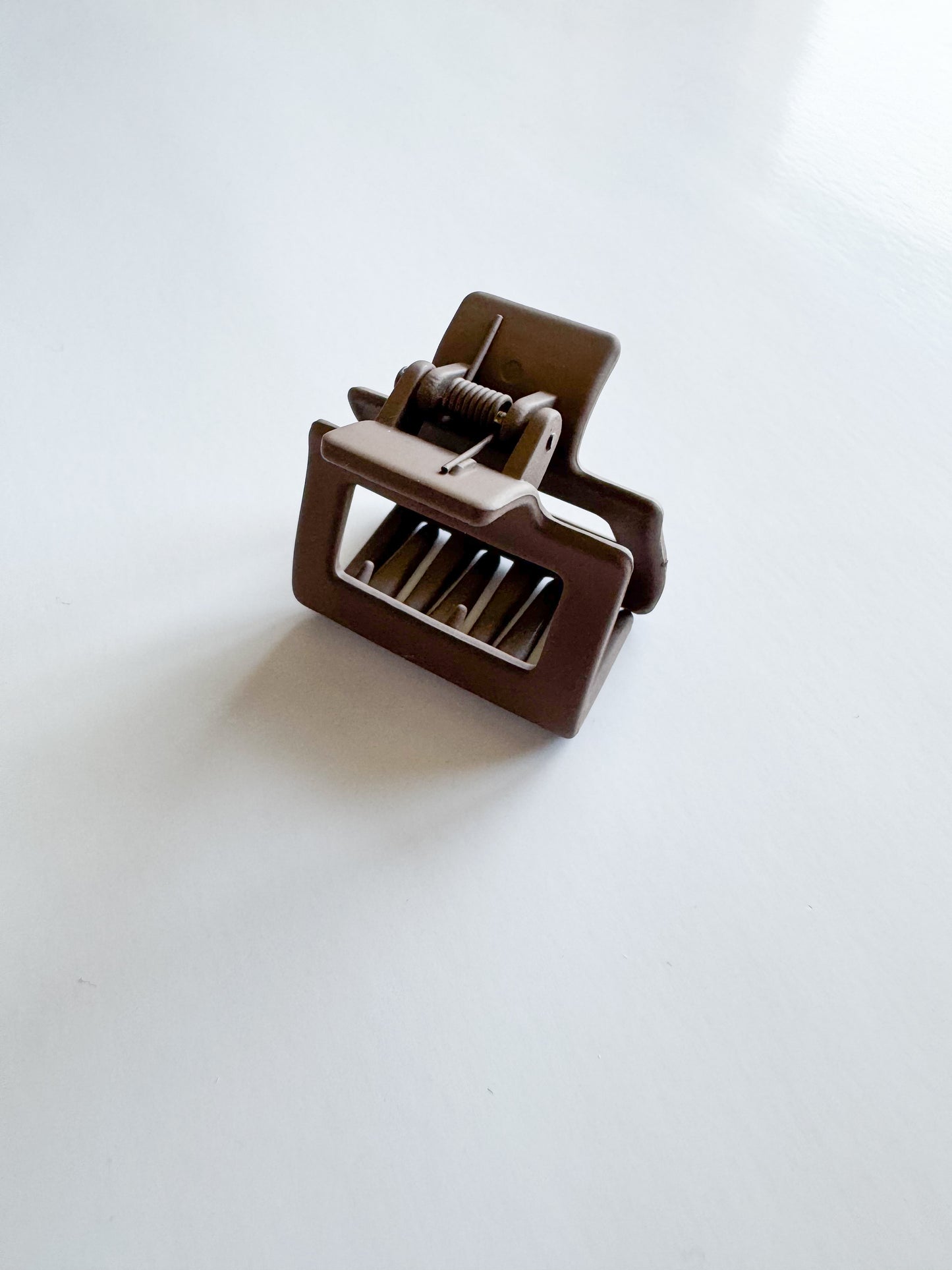 small rectangular hair claw in dark brown