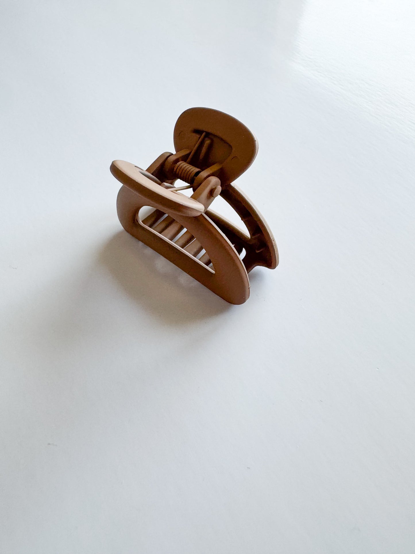 small semicircle hair claw in brown