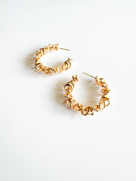 spiraled hoop earrings in gold