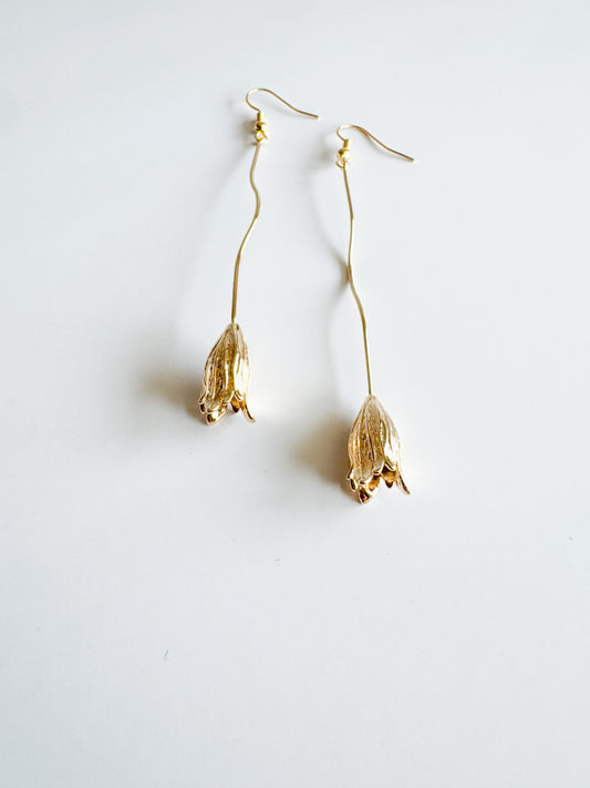 long flower earrings in gold