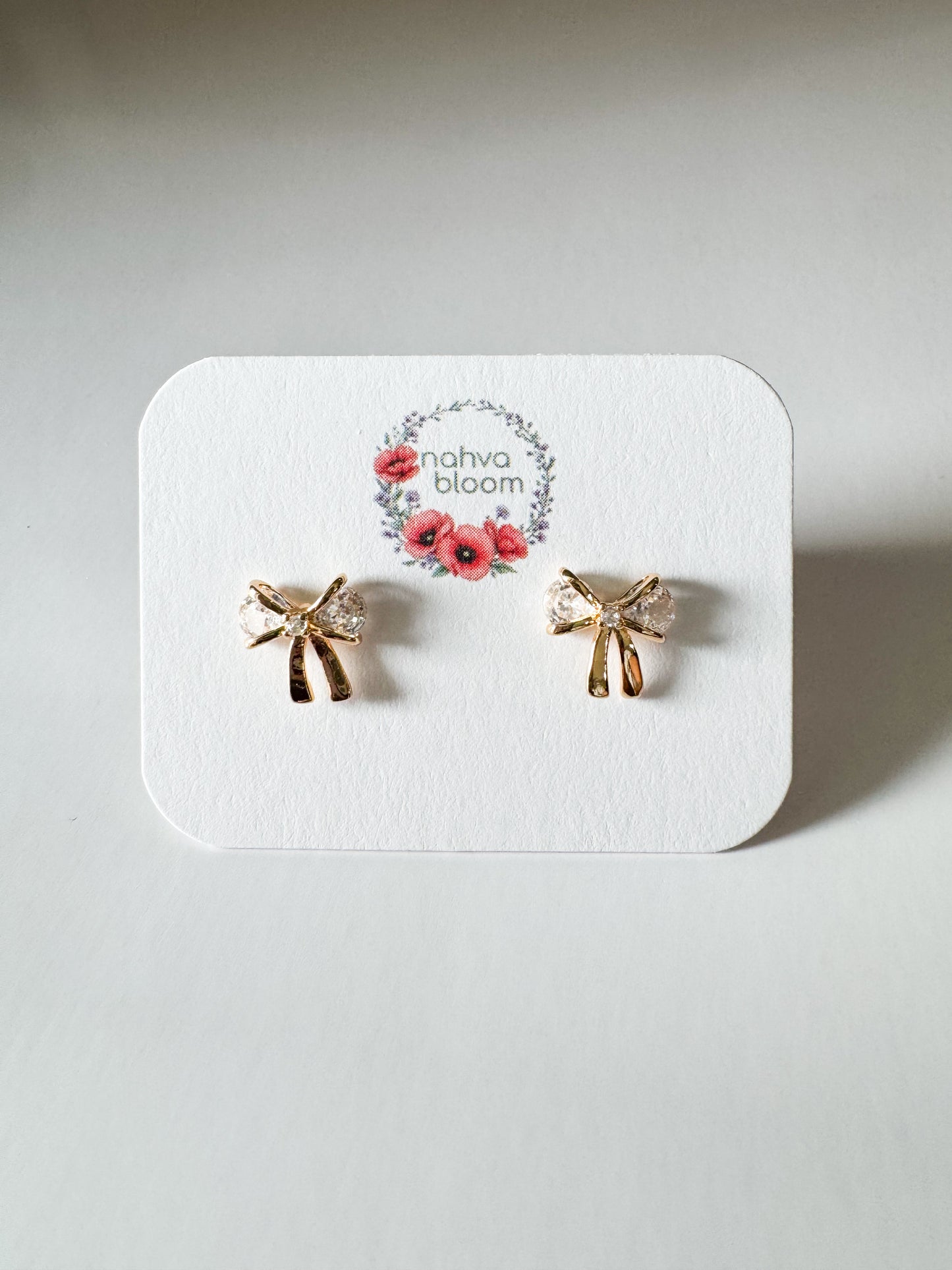 mini cubic zirconia bow studs in gold