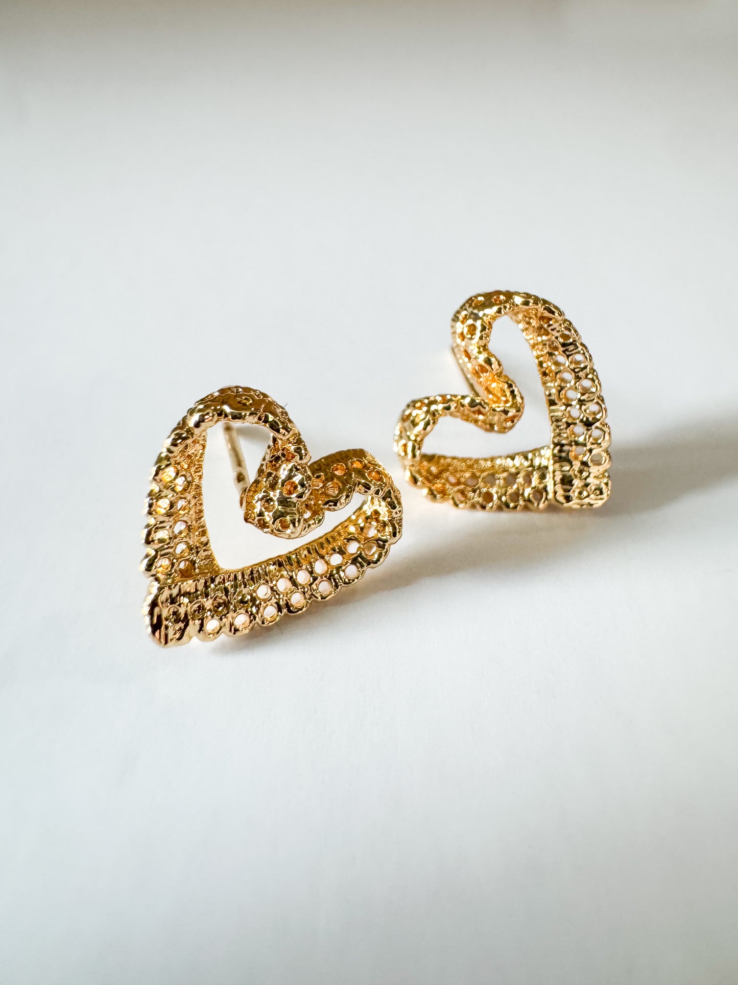 filigree heart studs in gold