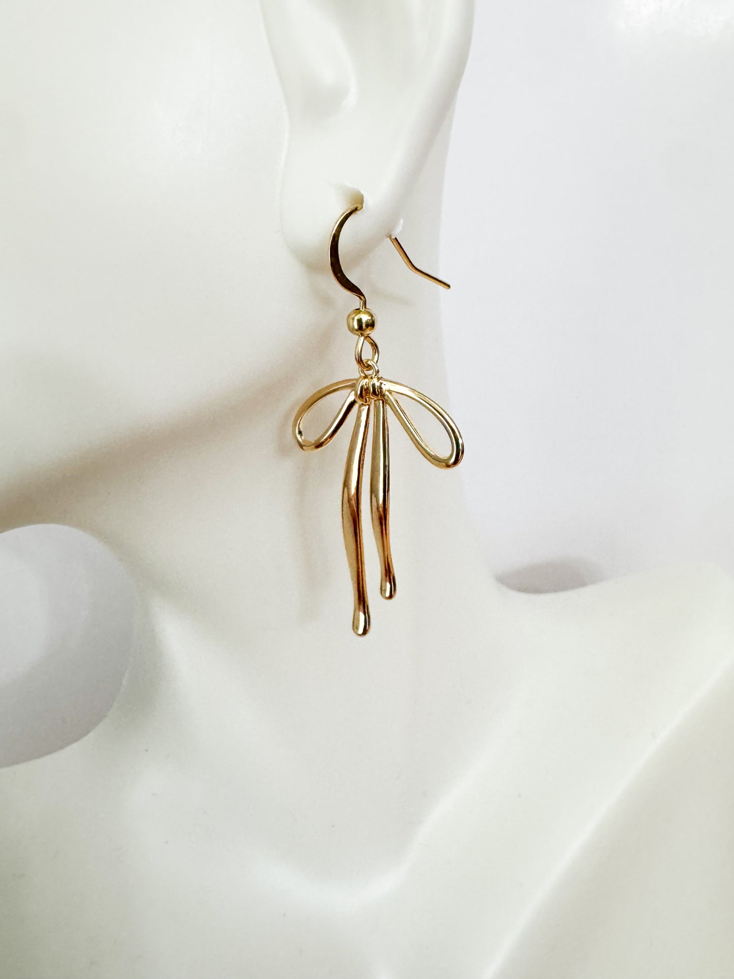 bow earrings in gold