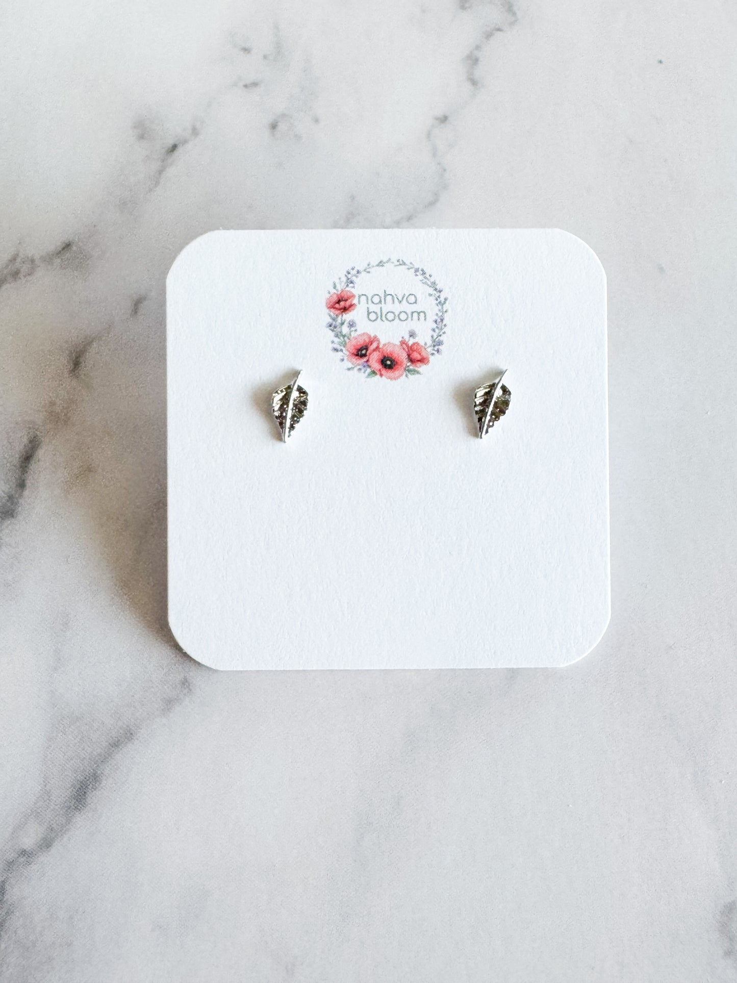 tiny leaf studs in silver
