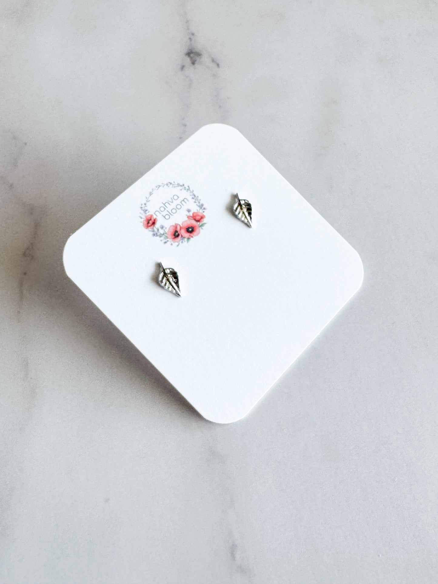 tiny leaf studs in silver