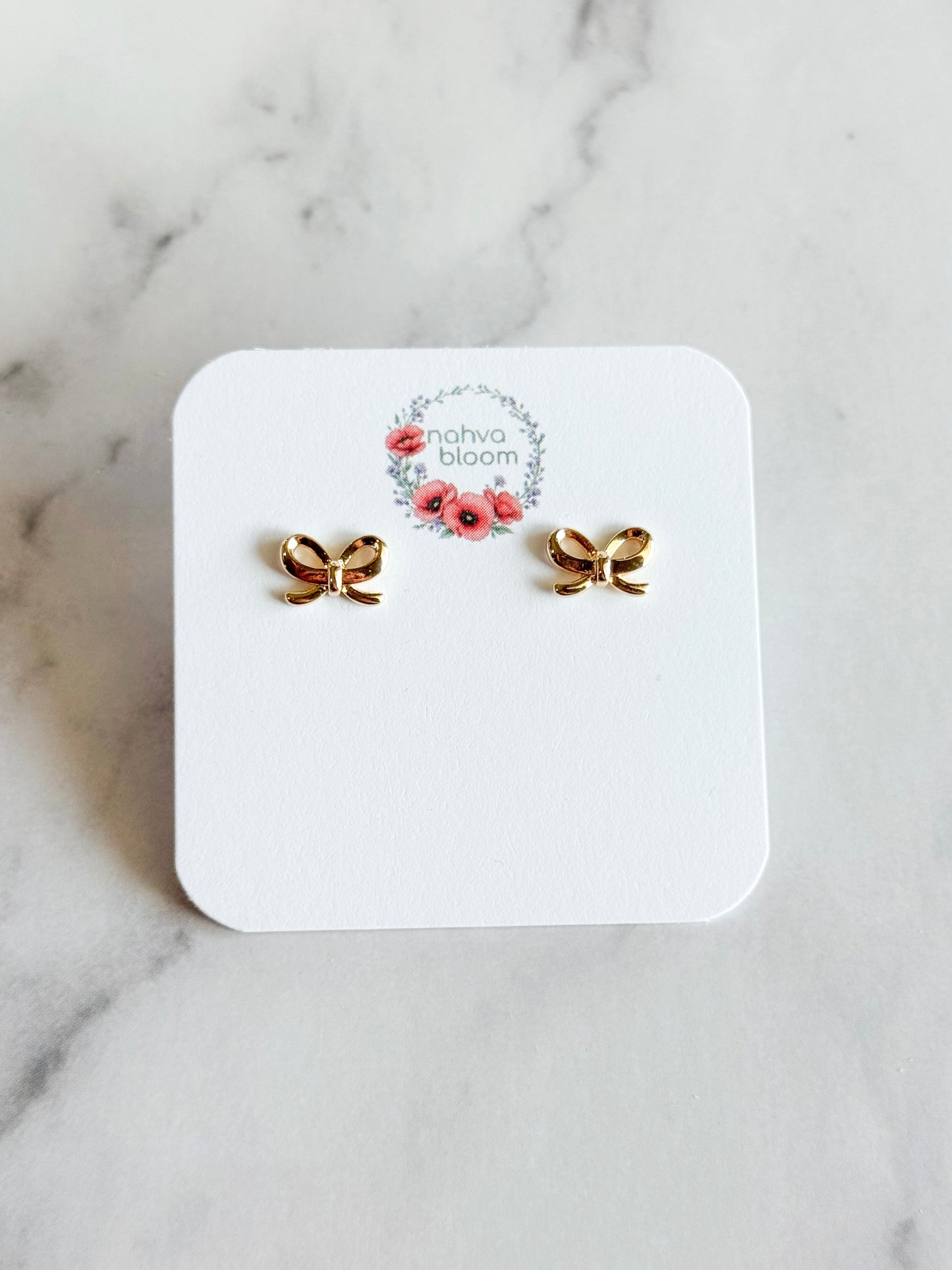 mini bow studs in gold