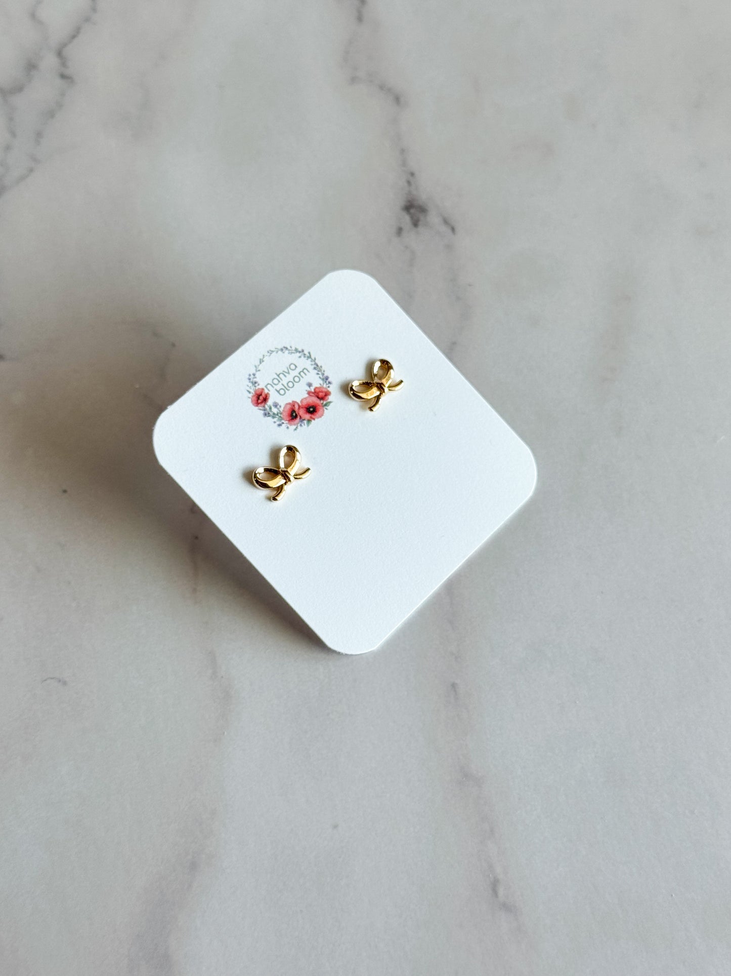 mini bow studs in gold