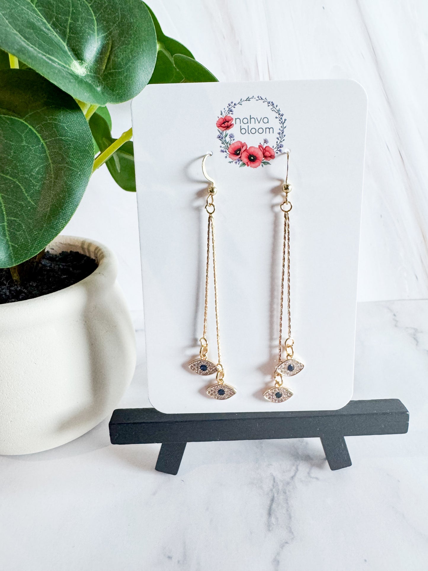 evil eye earrings in gold