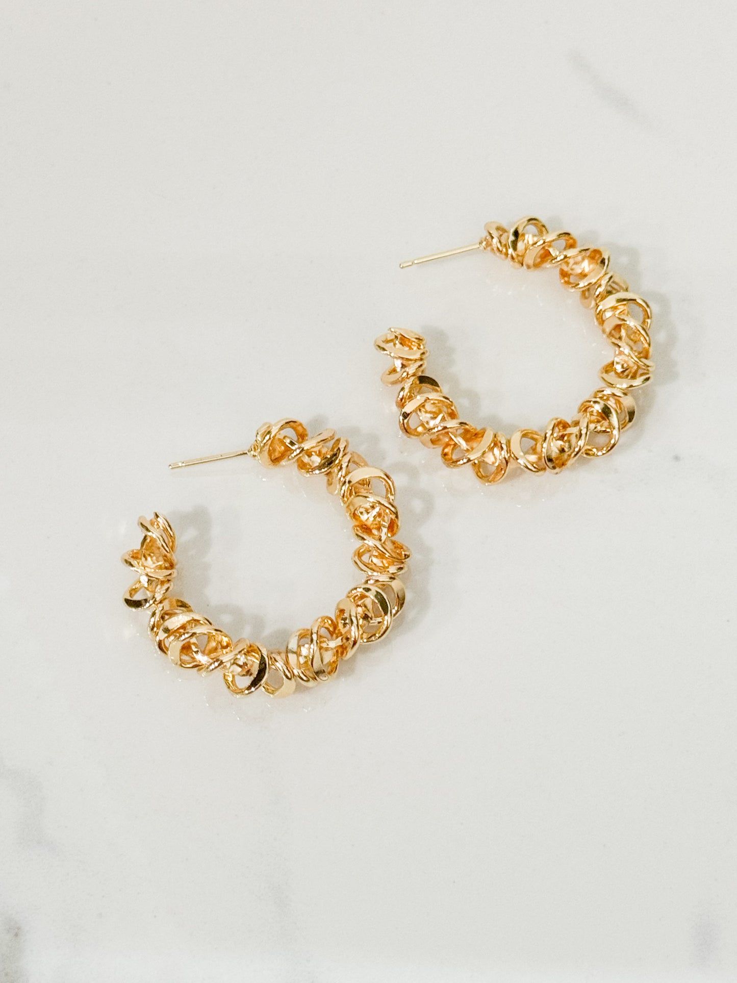 spiraled hoop earrings in gold