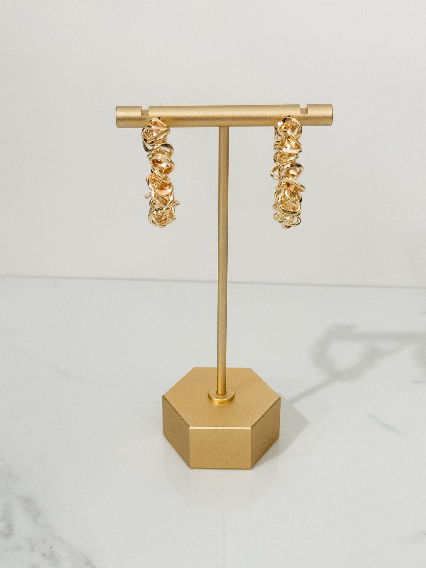 spiraled hoop earrings in gold