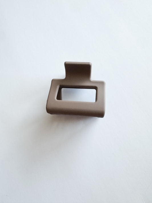 small rectangular hair claw in dark brown