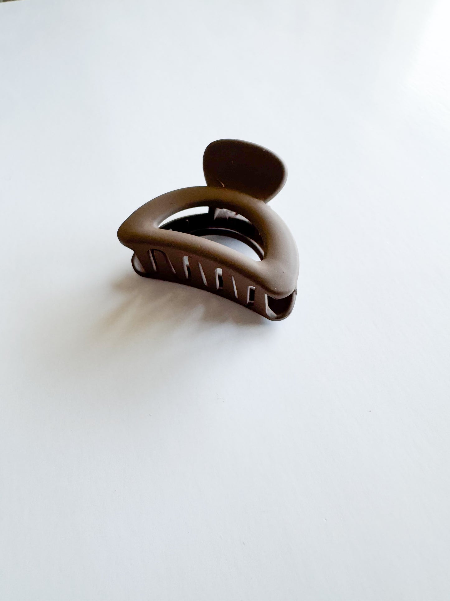 small semicircle hair claw in dark brown