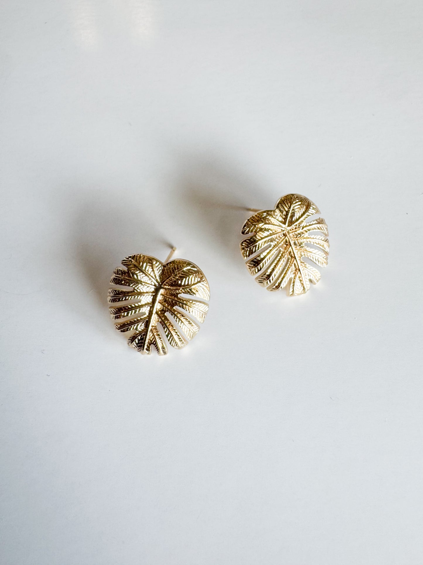 monstera leaf studs in gold