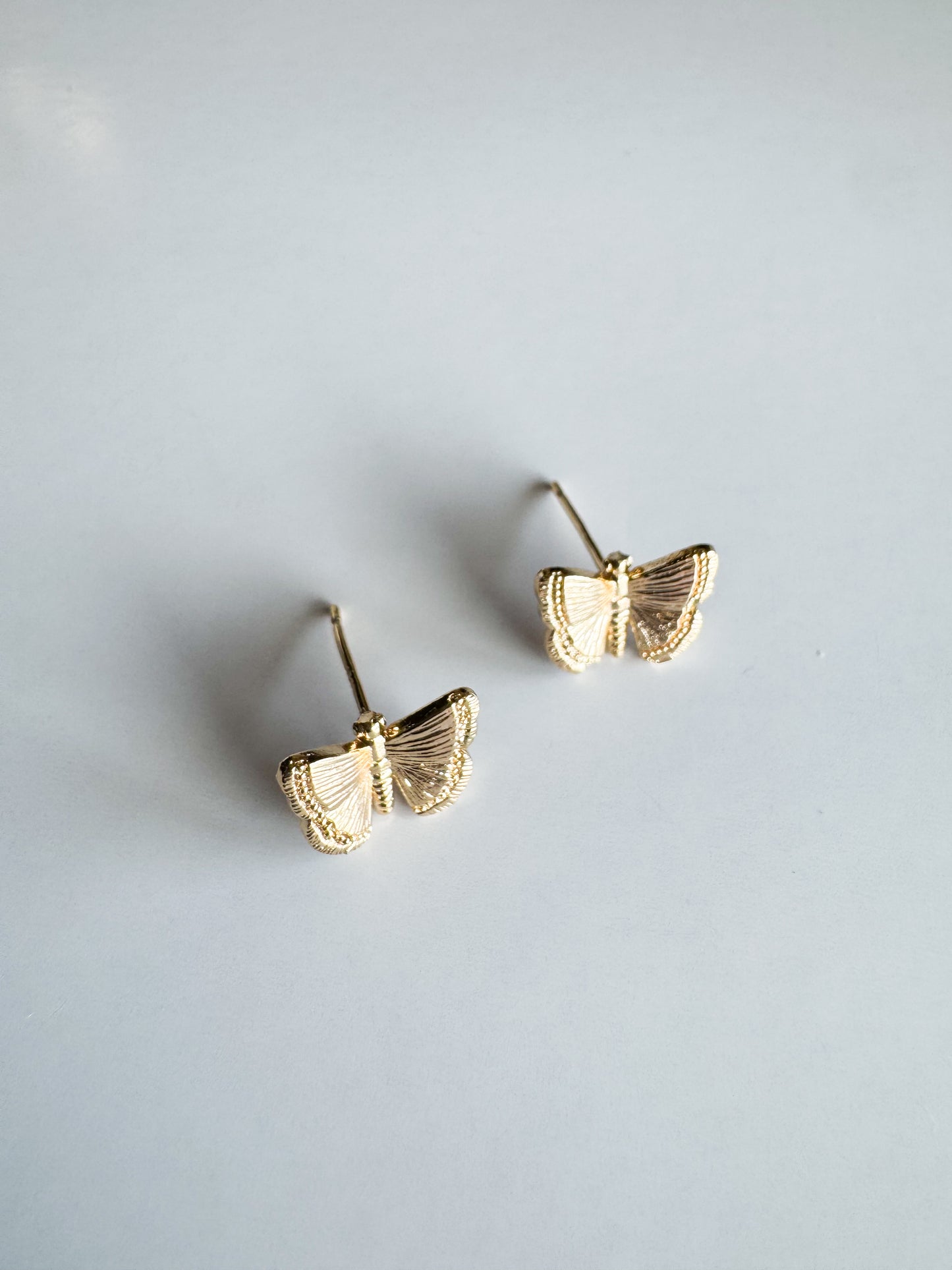 butterfly studs in gold