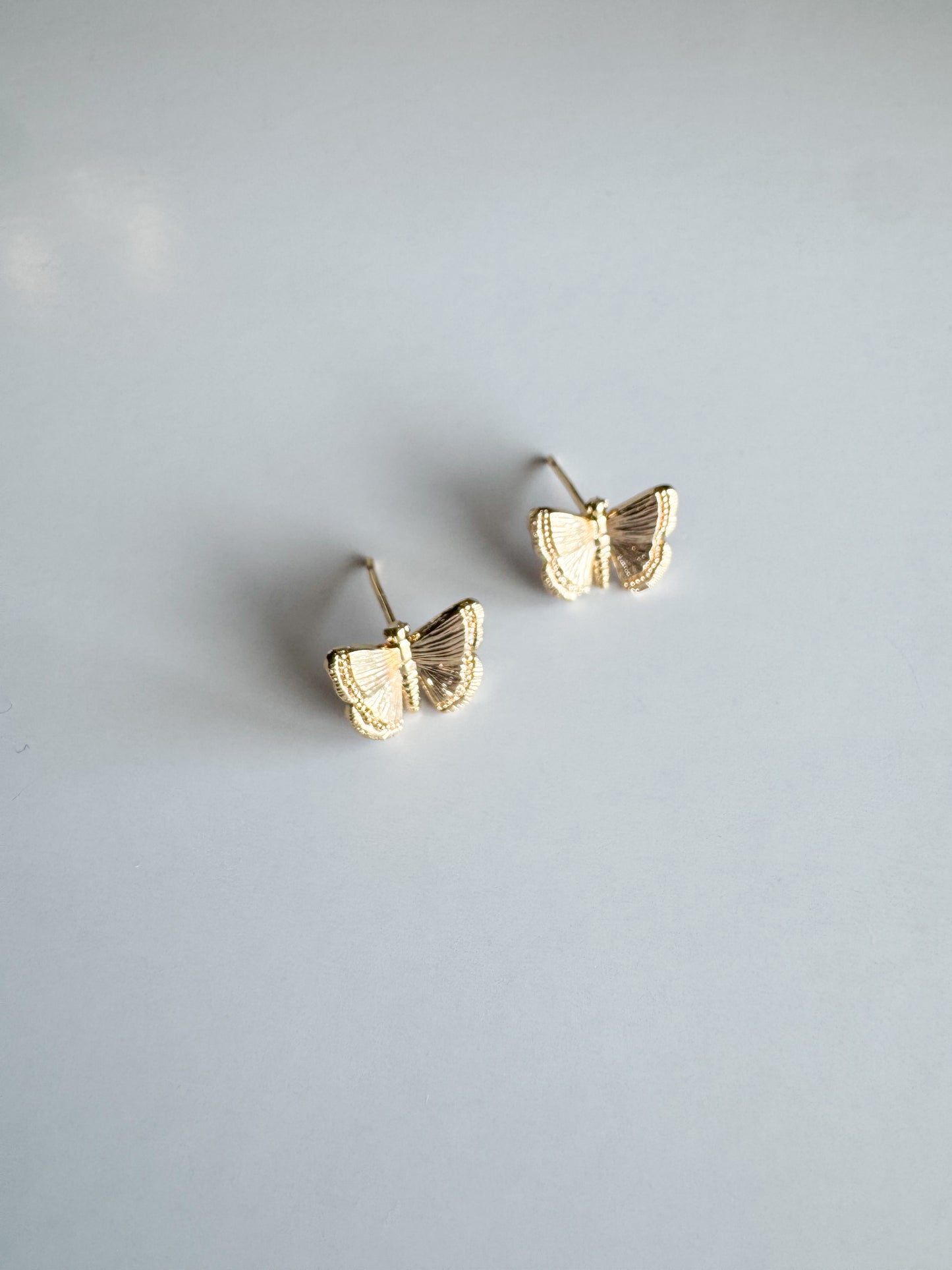 butterfly studs in gold
