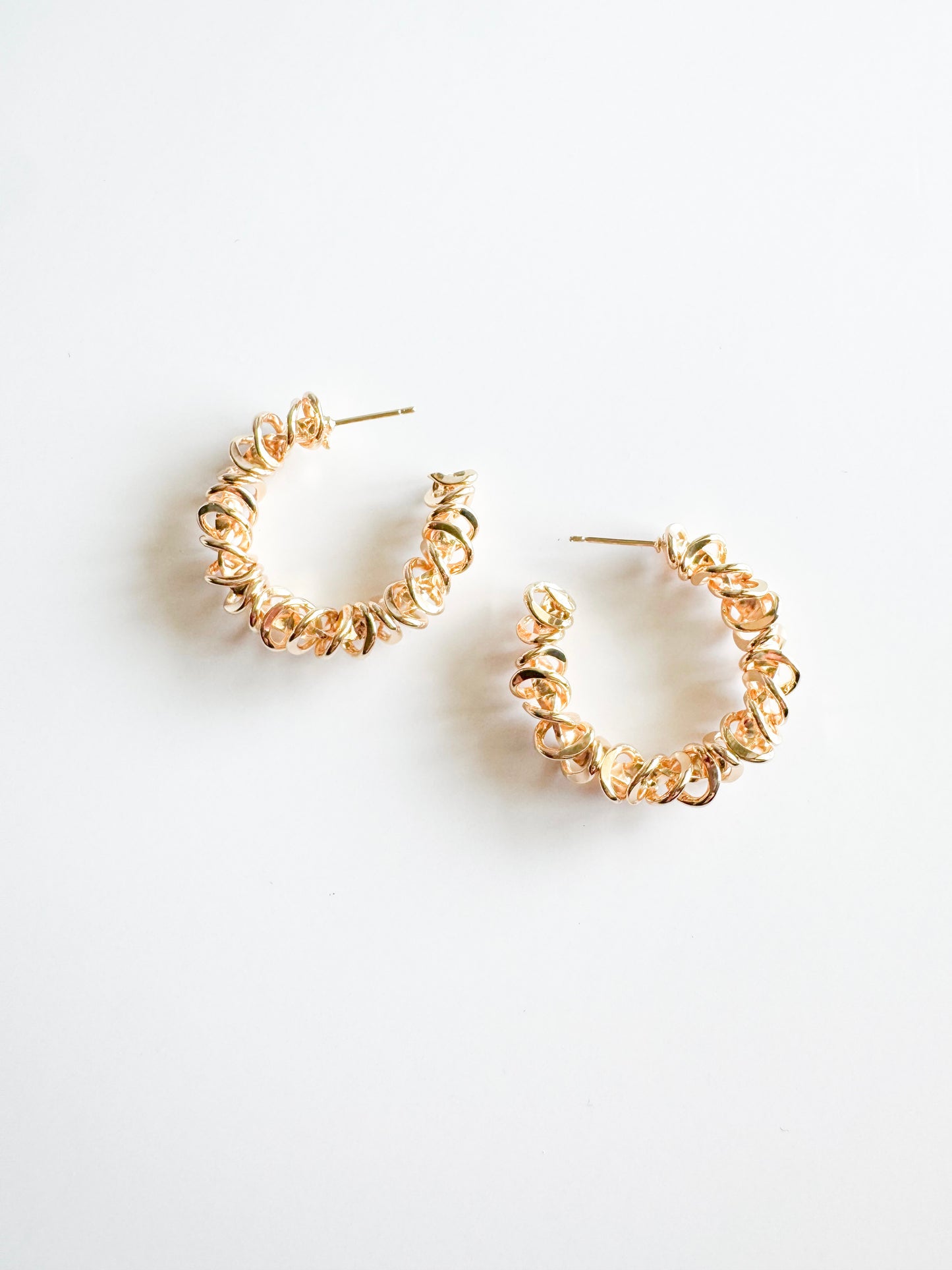 spiraled hoop earrings in gold
