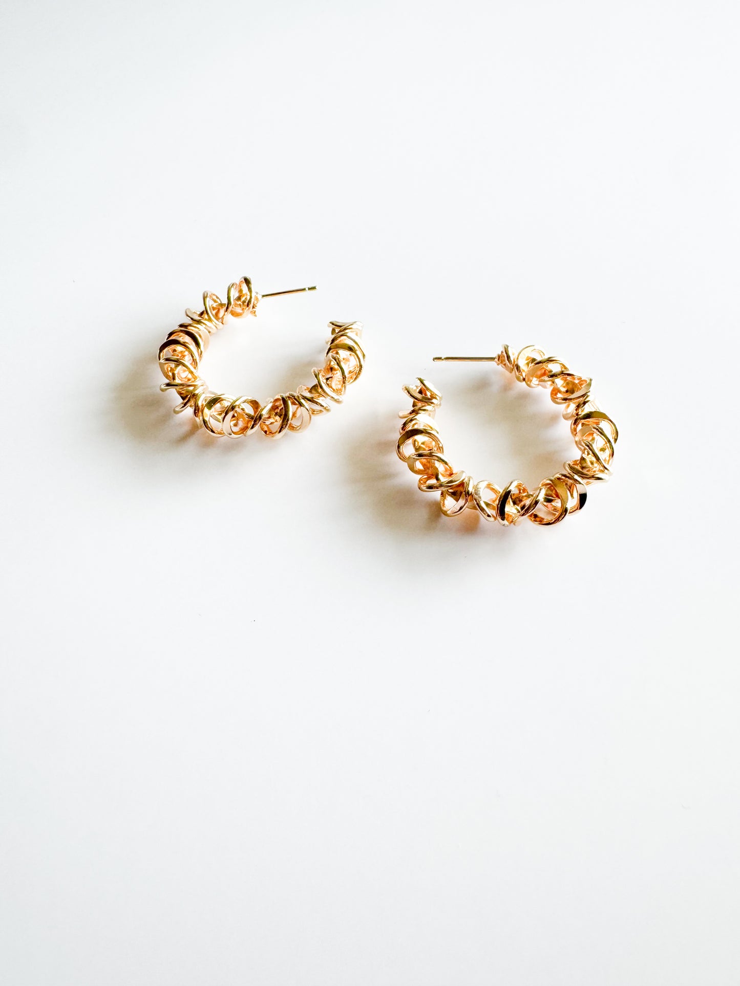 spiraled hoop earrings in gold