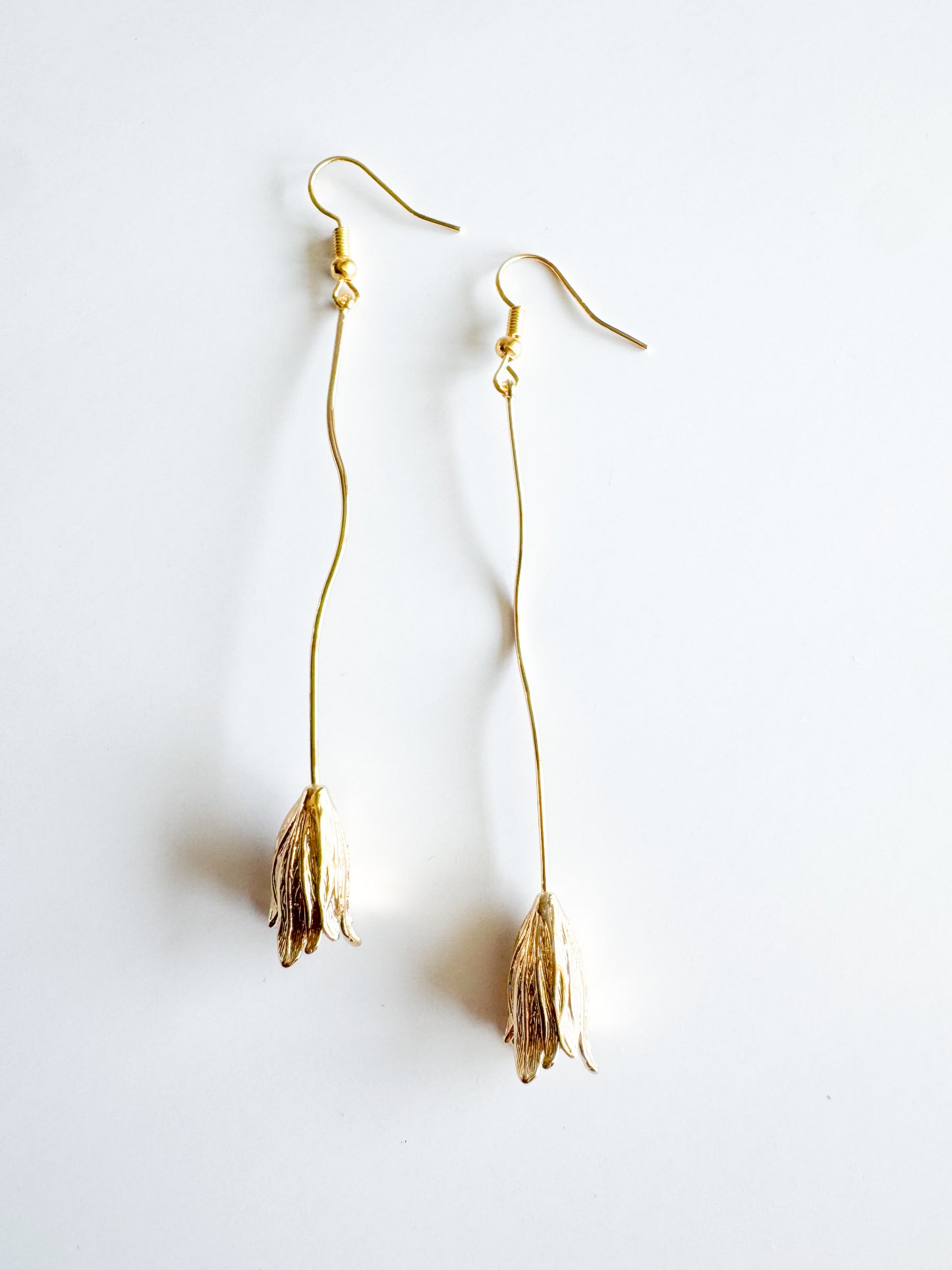 long flower earrings in gold