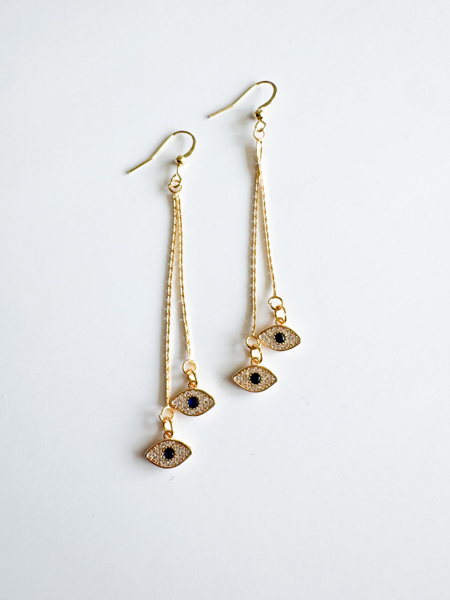 evil eye earrings in gold