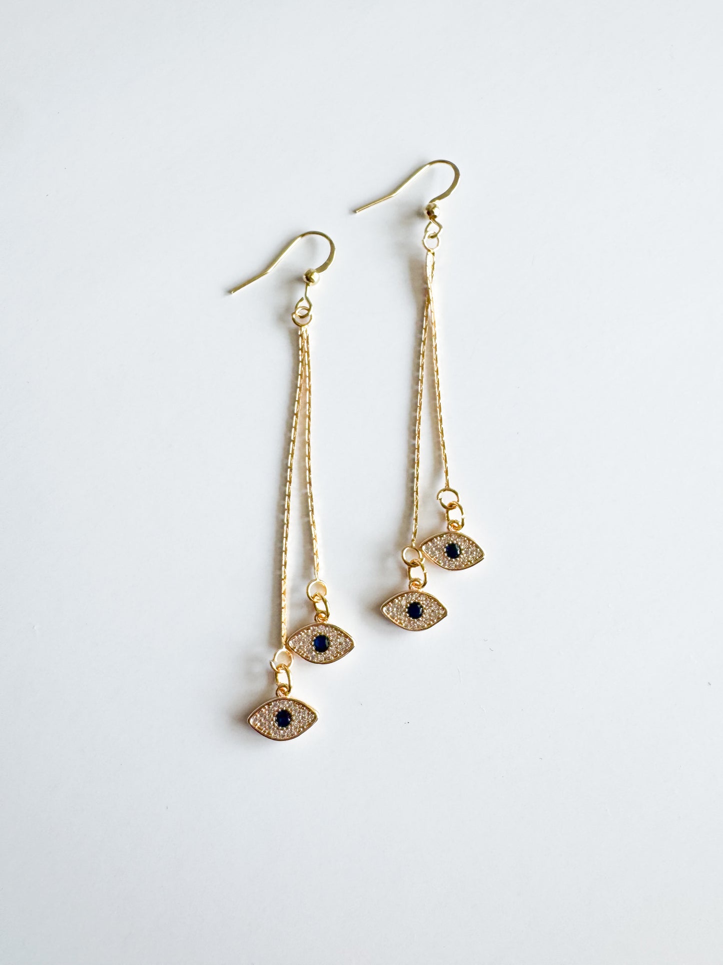 evil eye earrings in gold