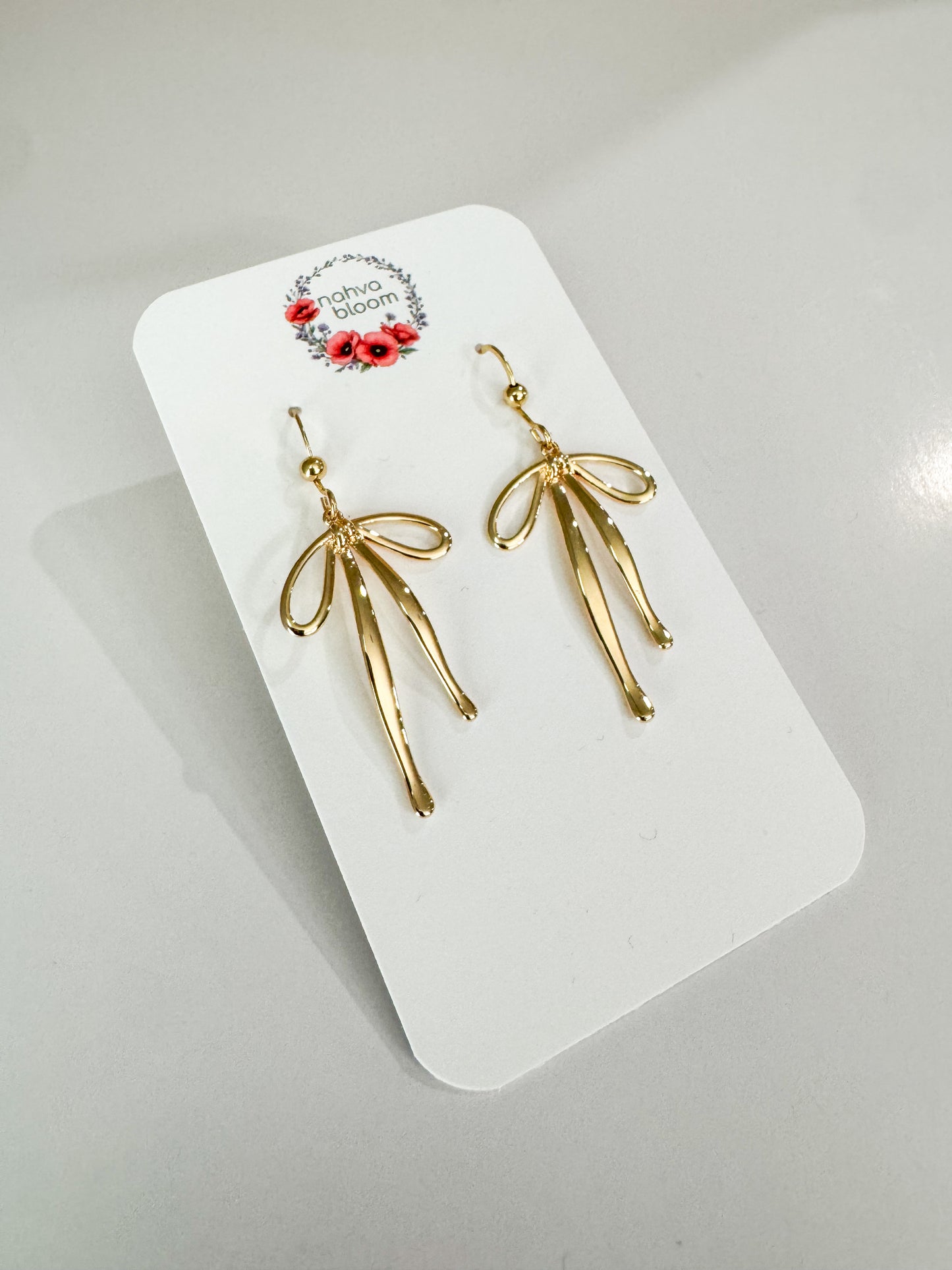 bow earrings in gold