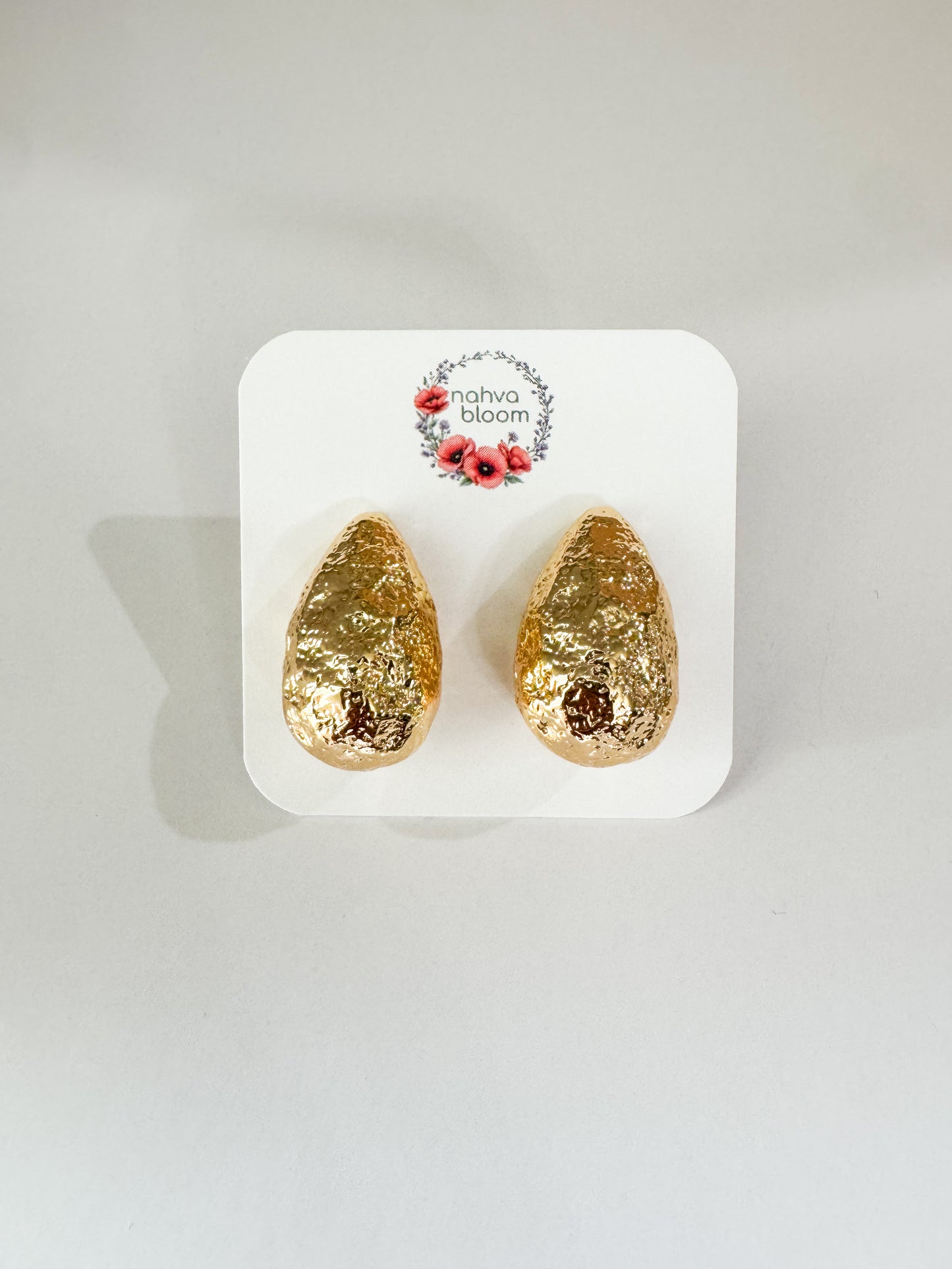 hammered teardrop studs in gold