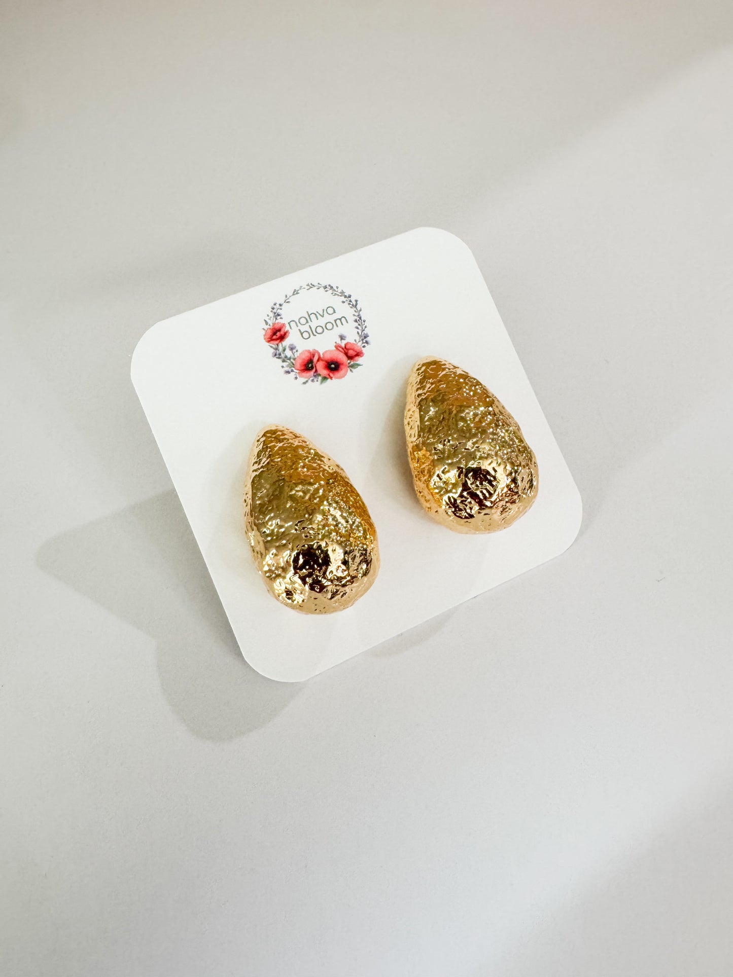 hammered teardrop studs in gold