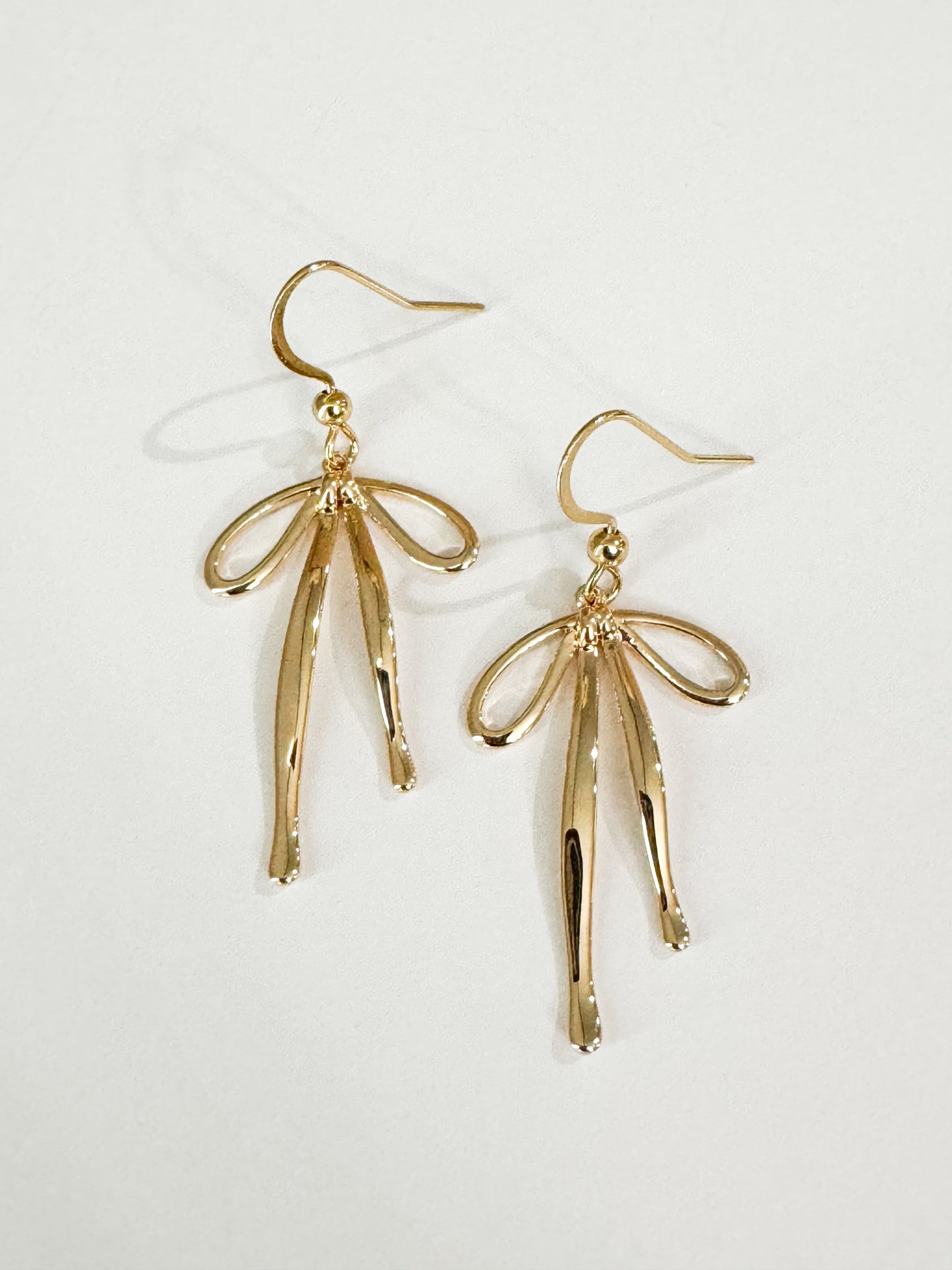 bow earrings in gold