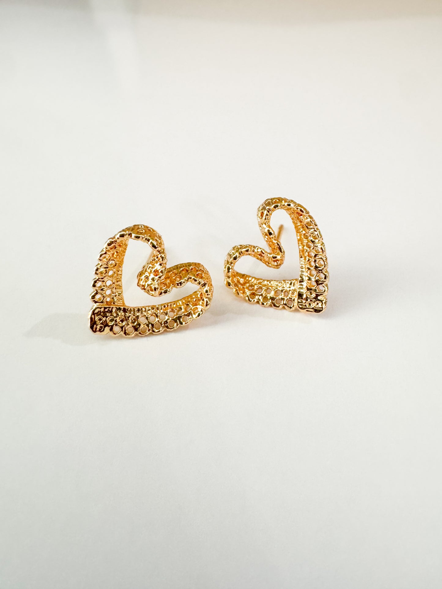 filigree heart studs in gold