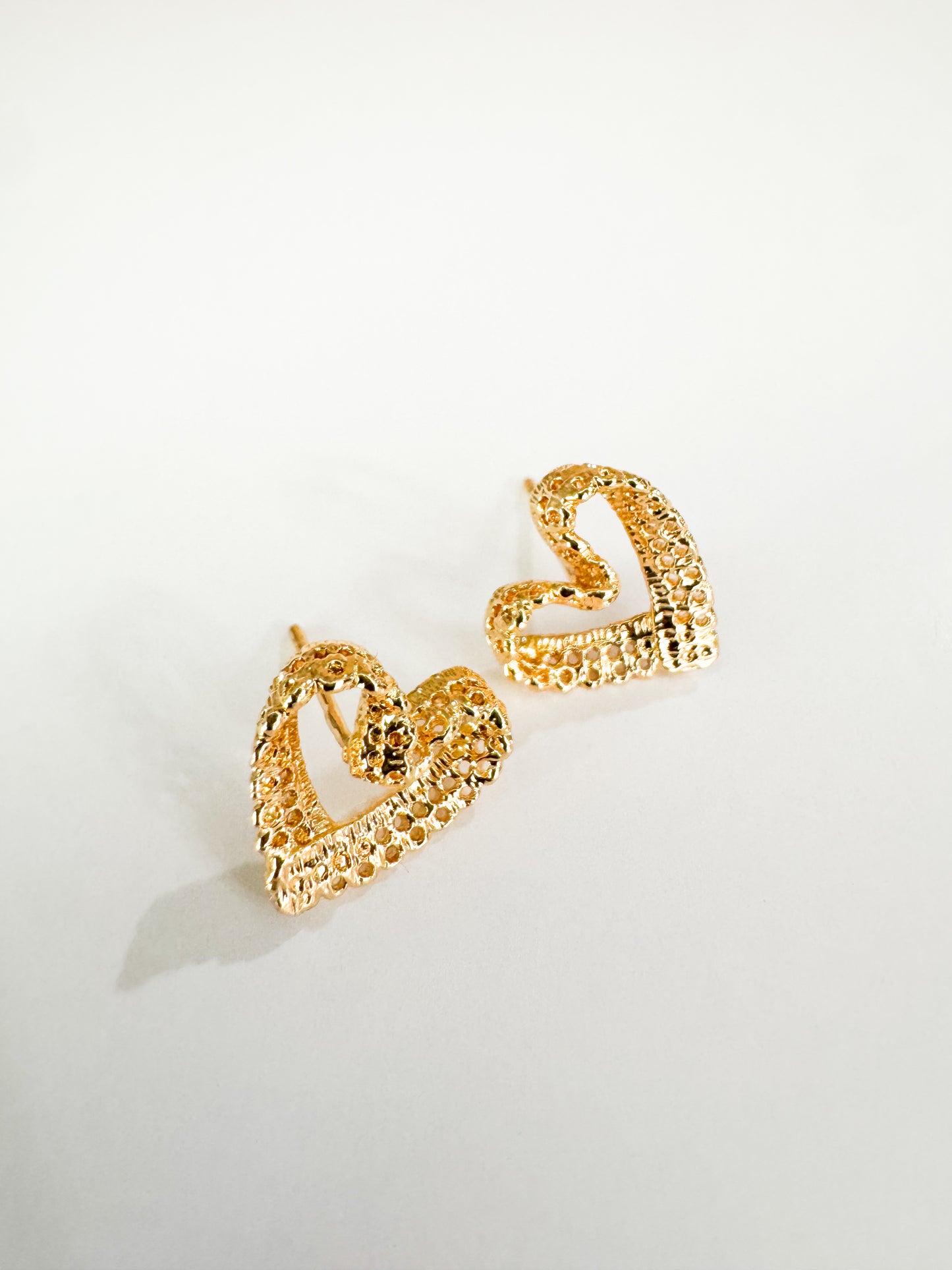 filigree heart studs in gold