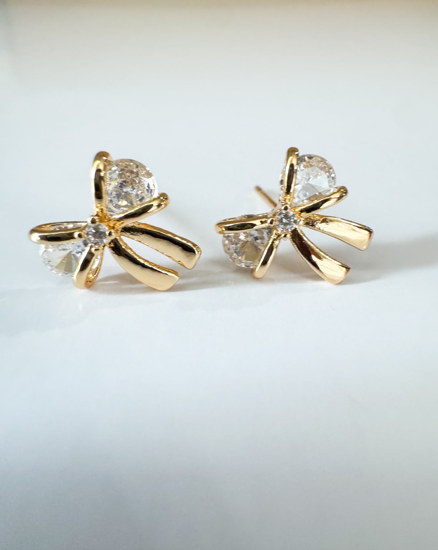 mini cubic zirconia bow studs in gold
