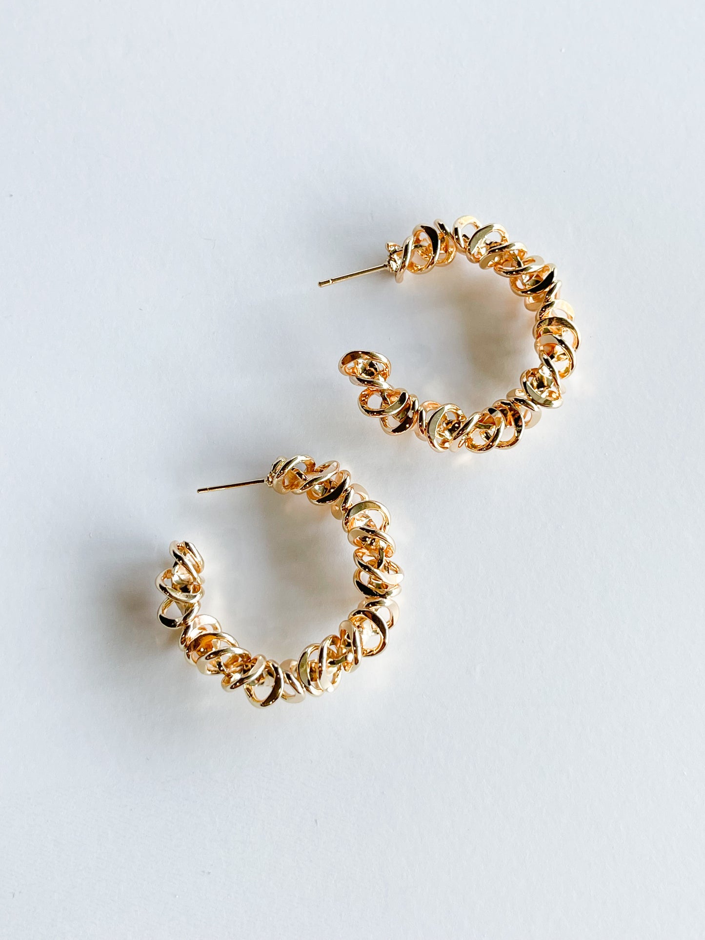 spiraled hoop earrings in gold
