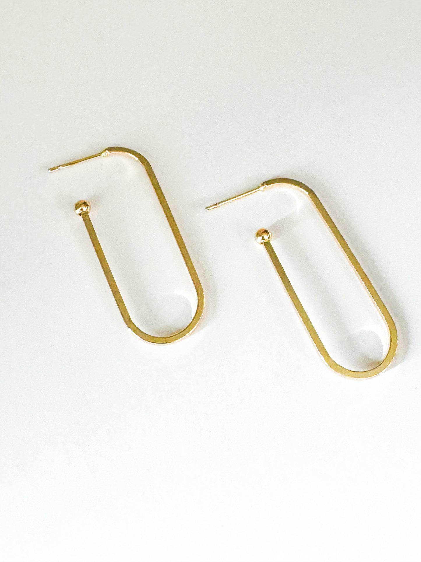 gold rounded rectangle hoop earrings