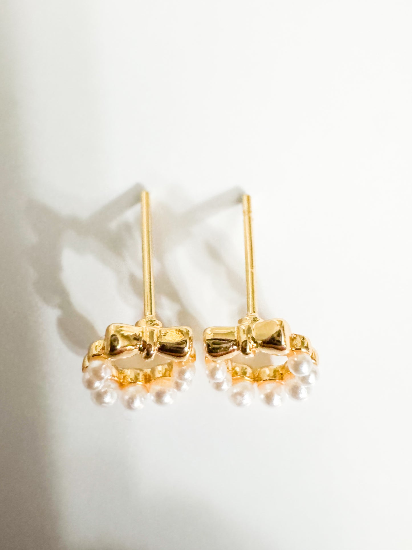 mini faux pearl with gold bow studs