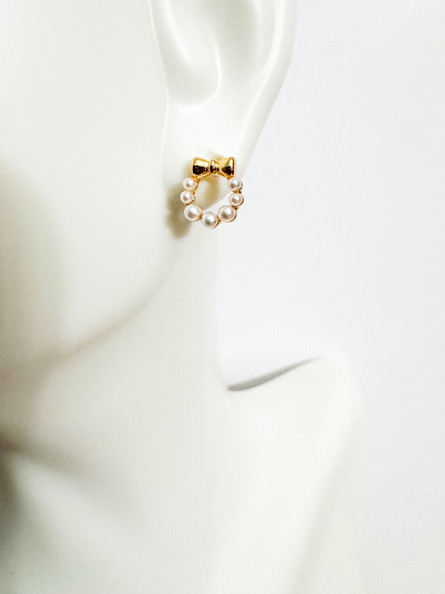 mini faux pearl with gold bow studs